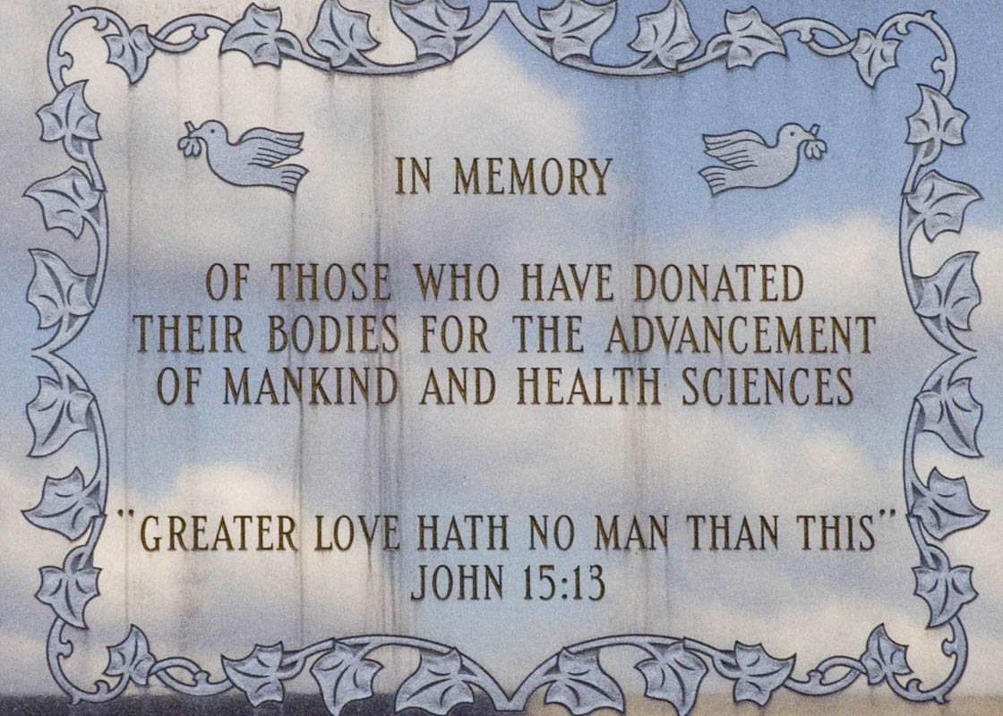 The memorial plague which says, "Of those who have donated their bodies for the advancement of mankind and health sciences. 'Greater Love hath no man than this' - John 15:13""