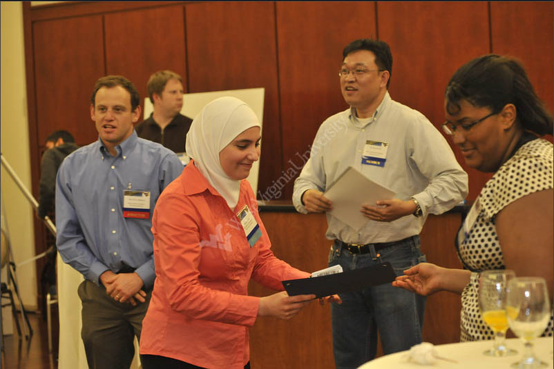 Therwa Hamza (PhD student) receiving the Best Graduate Student Poster Prize at the WVNano Research Symposium