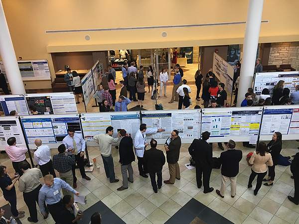 Students and Faculty observing posters at the 2017 E.J. Van Liere Memorial Convocation and HSC Research Day