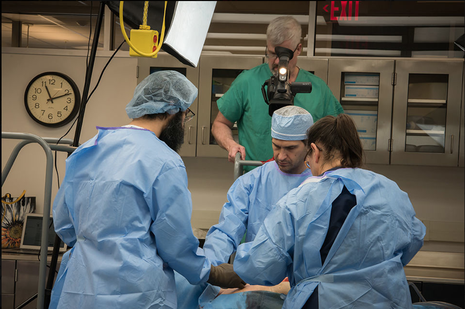 WVU Surgeons using a perfused cadaver in a simulated surgery.
