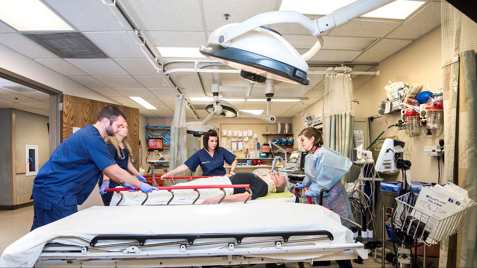 Emergency Medicine team helping patient
