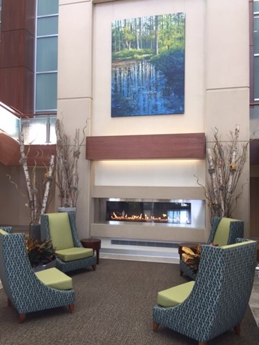 Chairs around a fireplace in the lobby