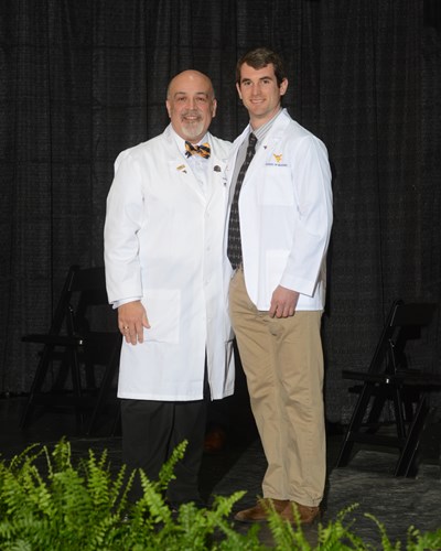 Photo of Julian Fazi receiving his white coat.