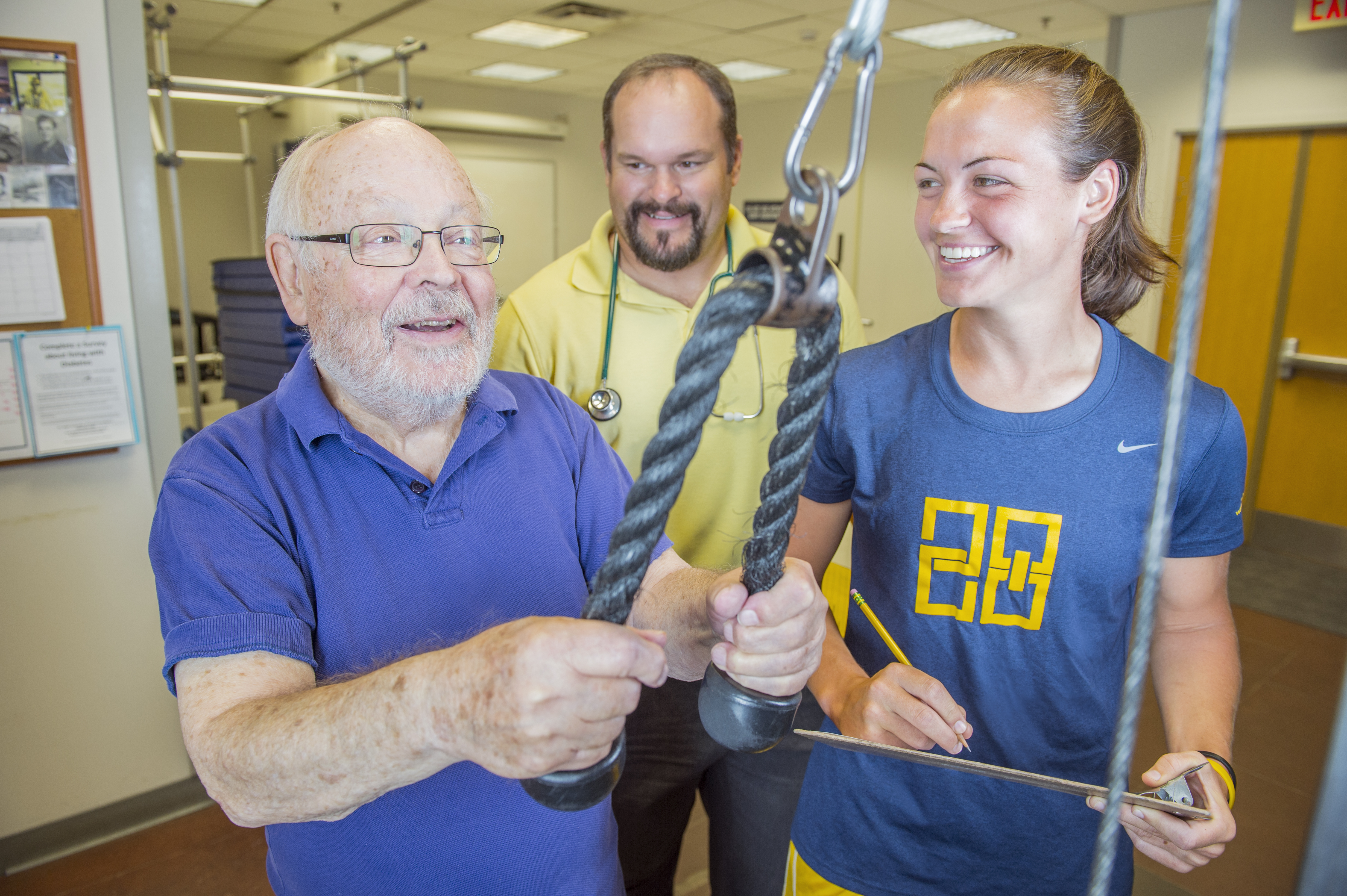 Photo of student working with their professor