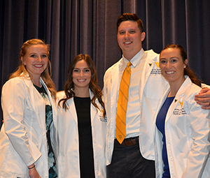Kelsie Gillespie, Victoria Rovello, Cole Salmons, Brittney Thomas (Class of 2020) receiving award from Dr. Corrie Mancinelli