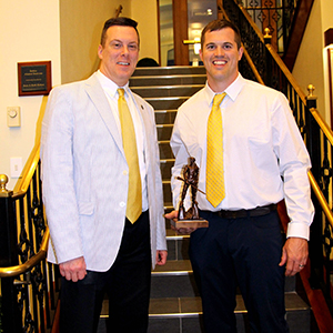 Trent J. Walker, PT, DPT (Class of 2015) receiving award from Dr. Ralph Utzman