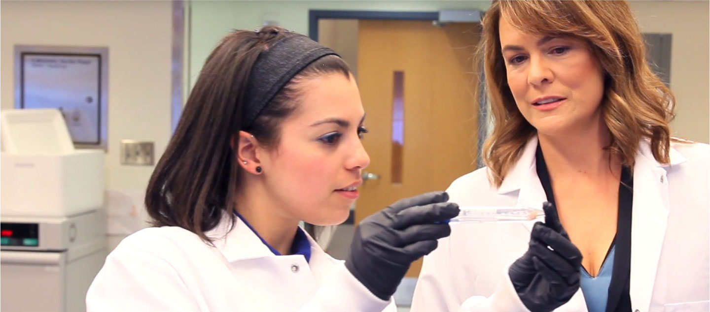 Graduate student and faculty member working in the lab