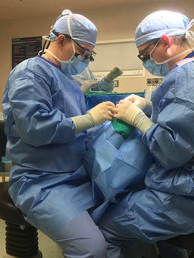 Two surgeons perform procedure