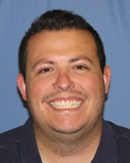 A head shot photo of Eddie Rojas, M.D..