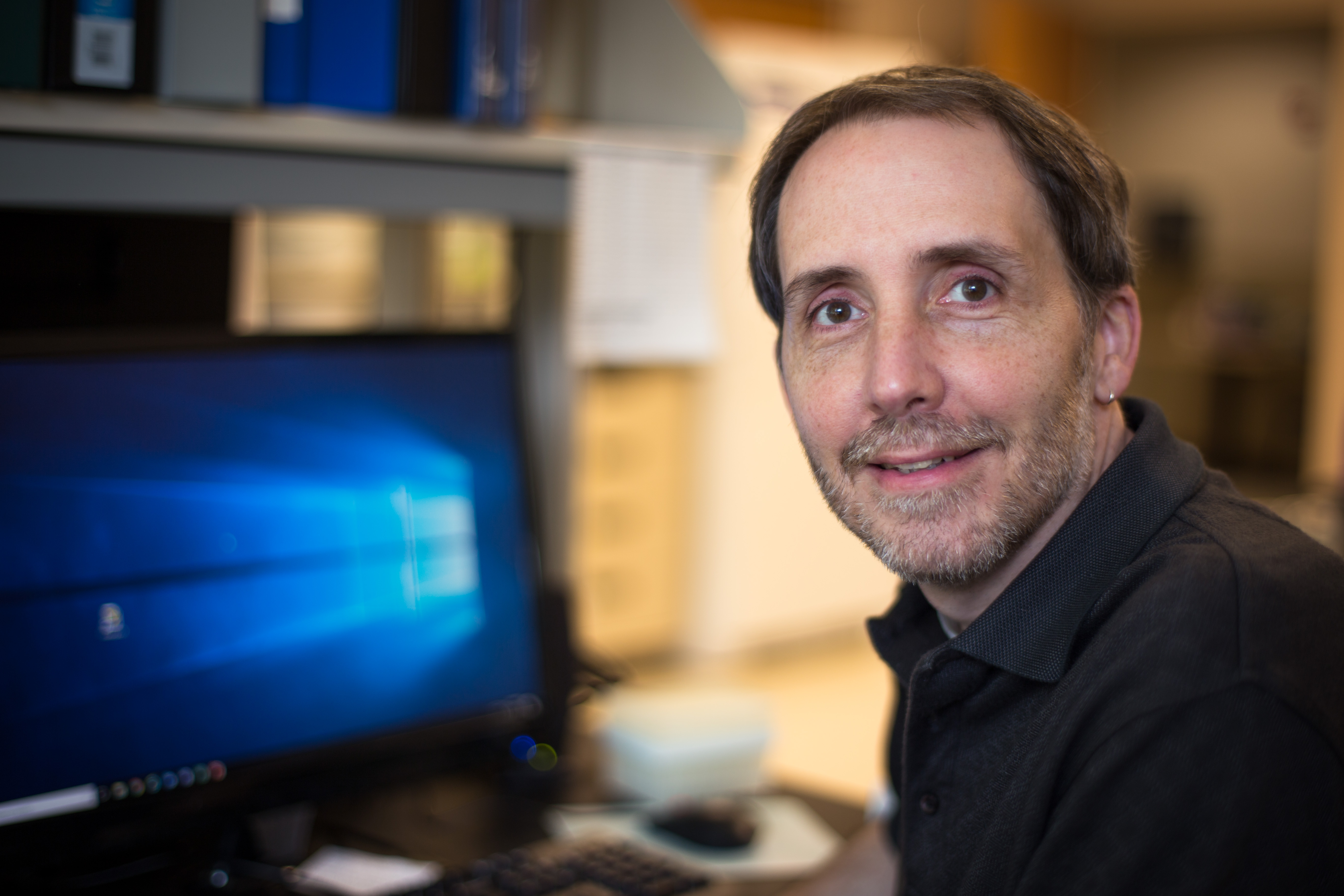 A headshot photo of Douglas Kolson.