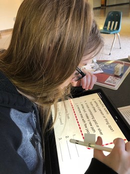 Low vision student enrolled in CVRP practices using specialized iPad