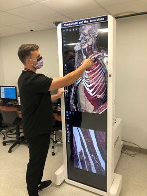 Fellow using an anatomy simulation table