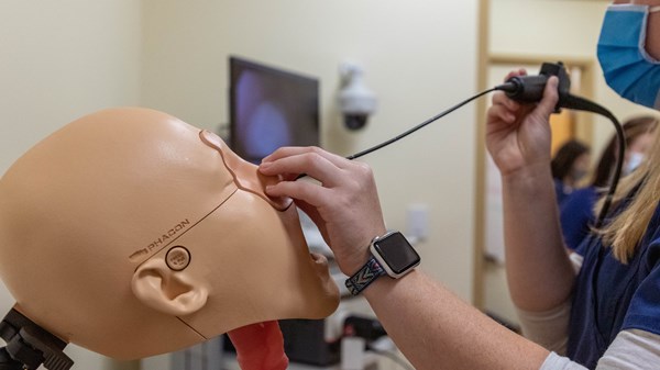 Students demonstrate equipment in the WVU Speech, Language, and Hearing Clinic