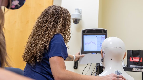 Students demonstrate equipment in the WVU Speech, Language, and Hearing Clinic