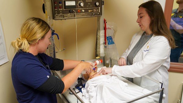 Residents practice neonatal care at the Simulation Lab located on the Eastern Campus