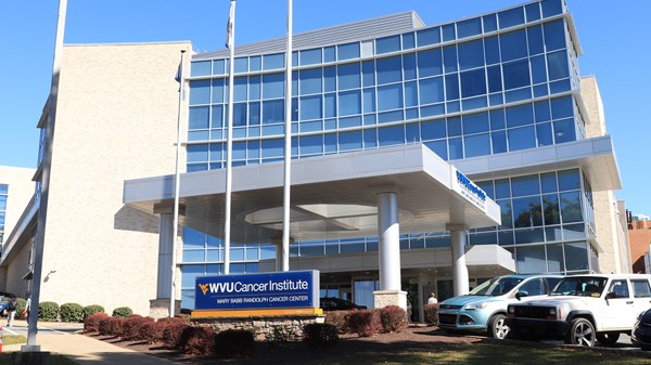 Exterior photo of WVU Cancer Institute on clear day