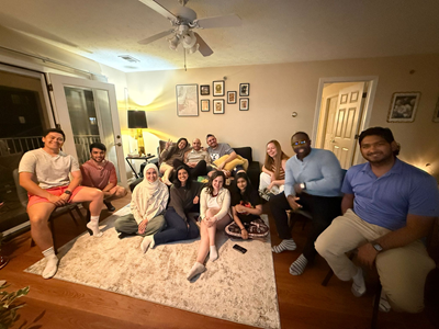 Residents gathered as a group in a cozy living room.
