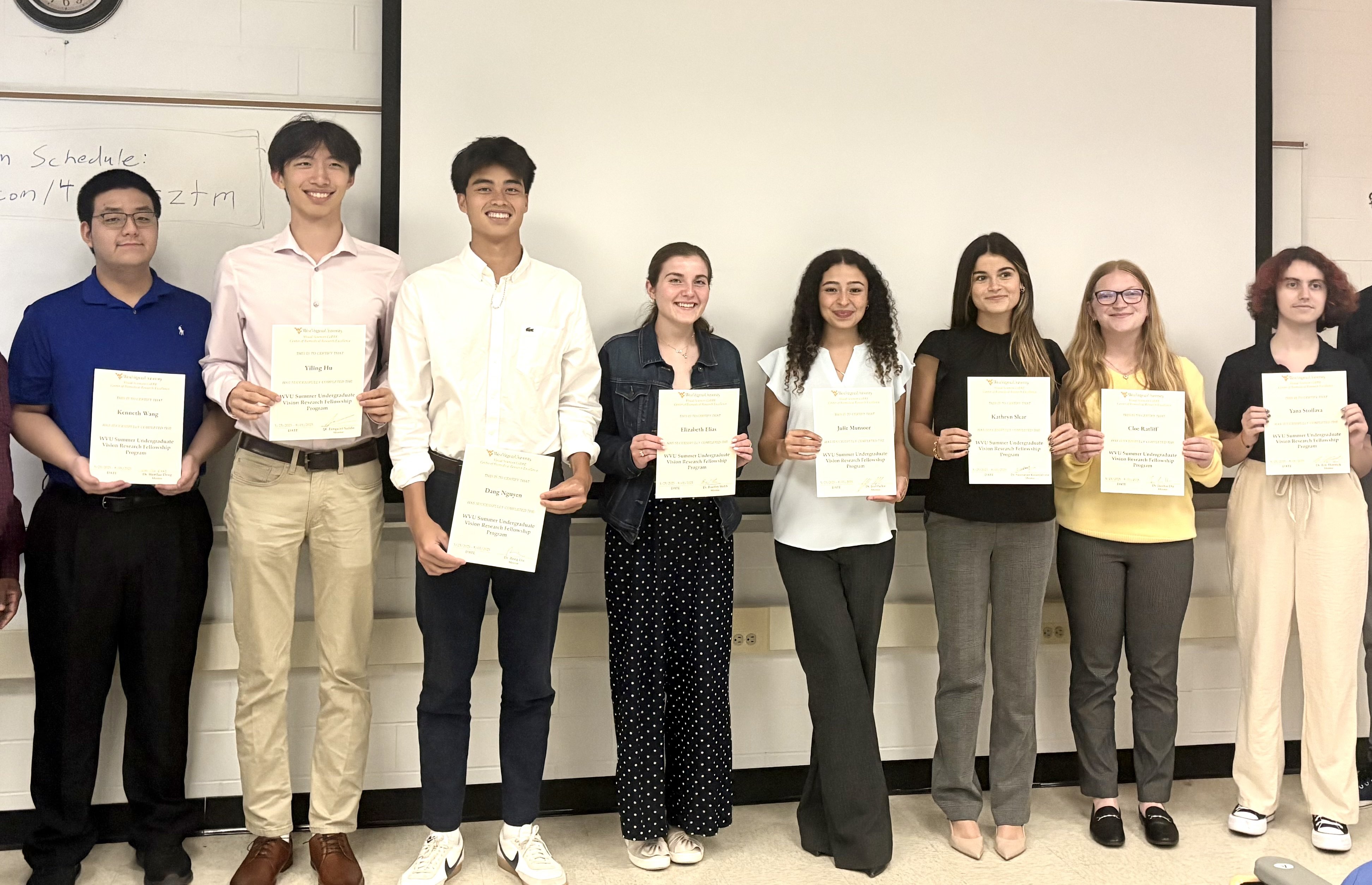 Picture of all eight graduates of the Summer Undergraduate Vision Research Fellowship Program in 2025