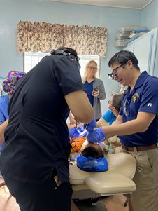 Dr. John Nguyen performs a procedure on a Honduran patient